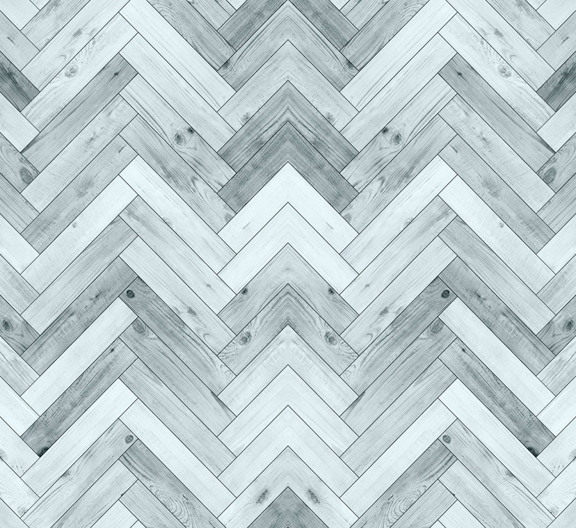 Close-up of vinyl wallpaper panel with light blue-gray herringbone wood-look chevrons