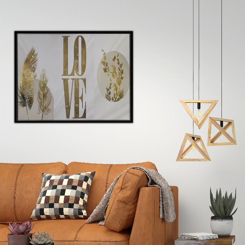 Framed gold LOVE wall art print with feather and leaf designs on light background