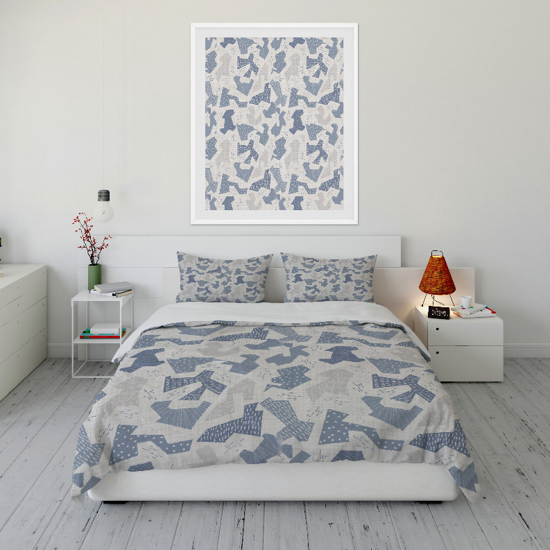 Blue and white patterned comforter with two matching pillow shams