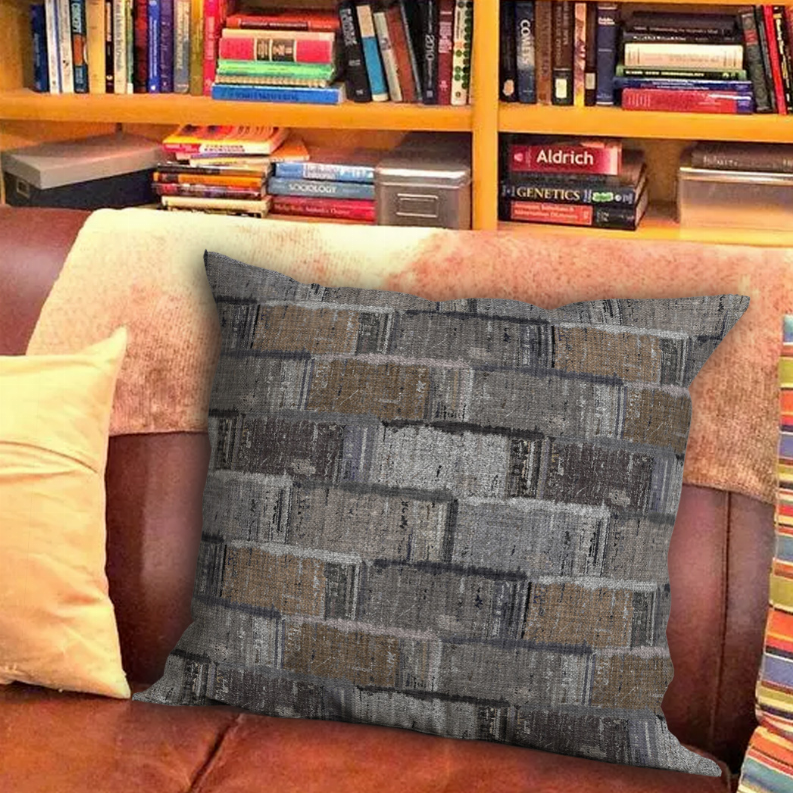 Decorative square pillow with textured gray and tan distressed block pattern