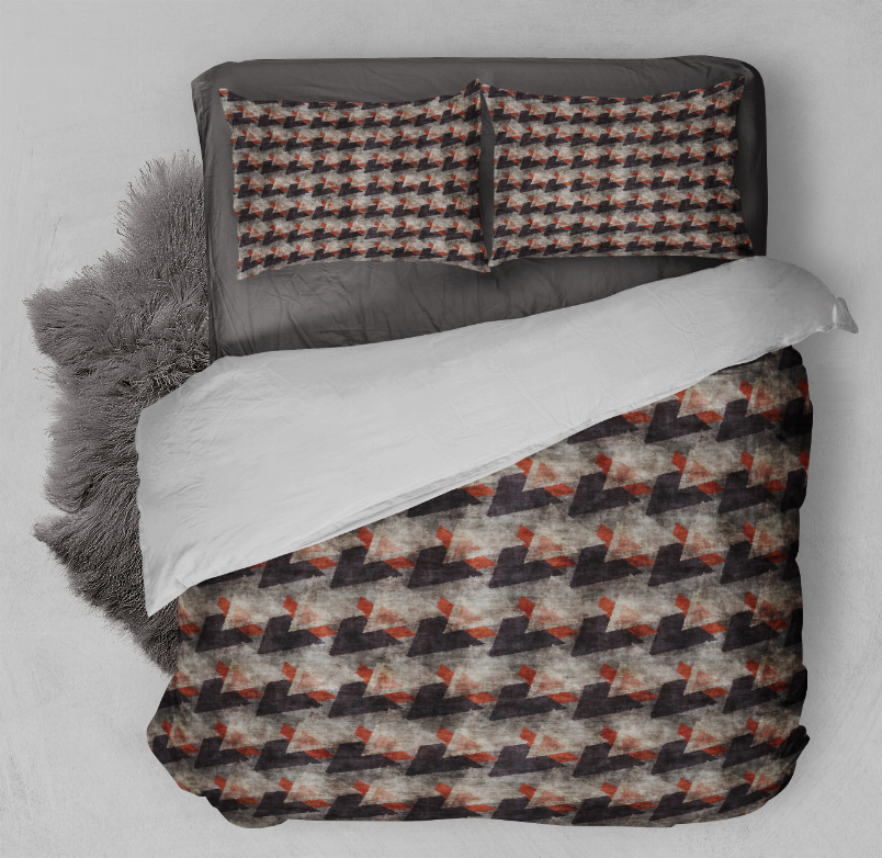 Geometric comforter set with dark pattern and orange accents, plus two pillow shams