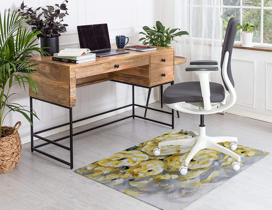 Low pile carpet with abstract yellow floral pattern on gray ground