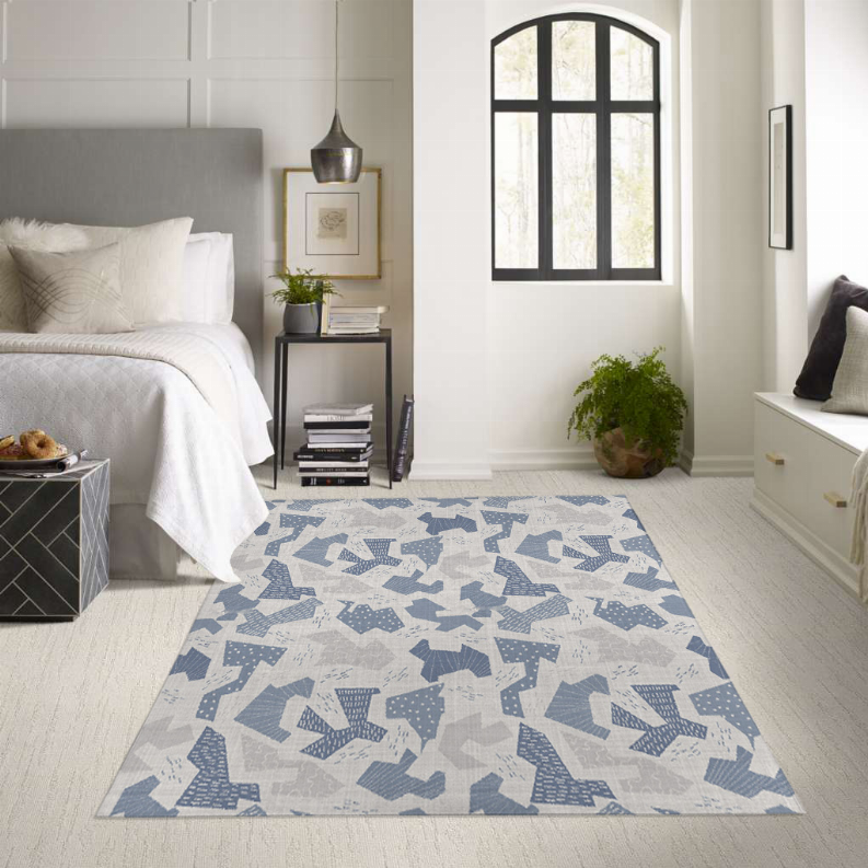 Low pile carpet rug with blue and gray geometric pattern