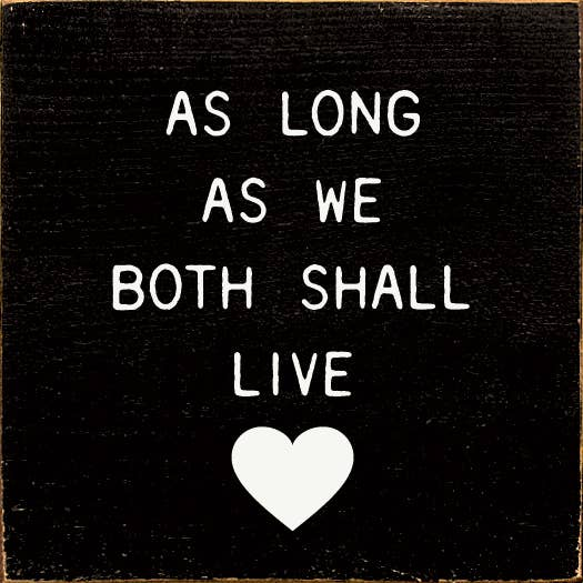 Black fabric patch with white quote text and heart