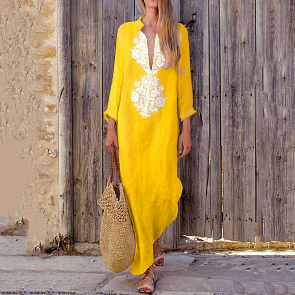 Yellow linen maxi dress with white embroidered V neckline and loose sleeves