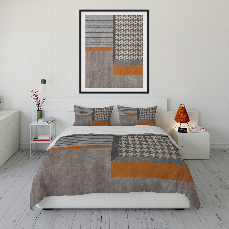 Gray comforter with houndstooth right panel and orange stripe accents, plus two pillow shams