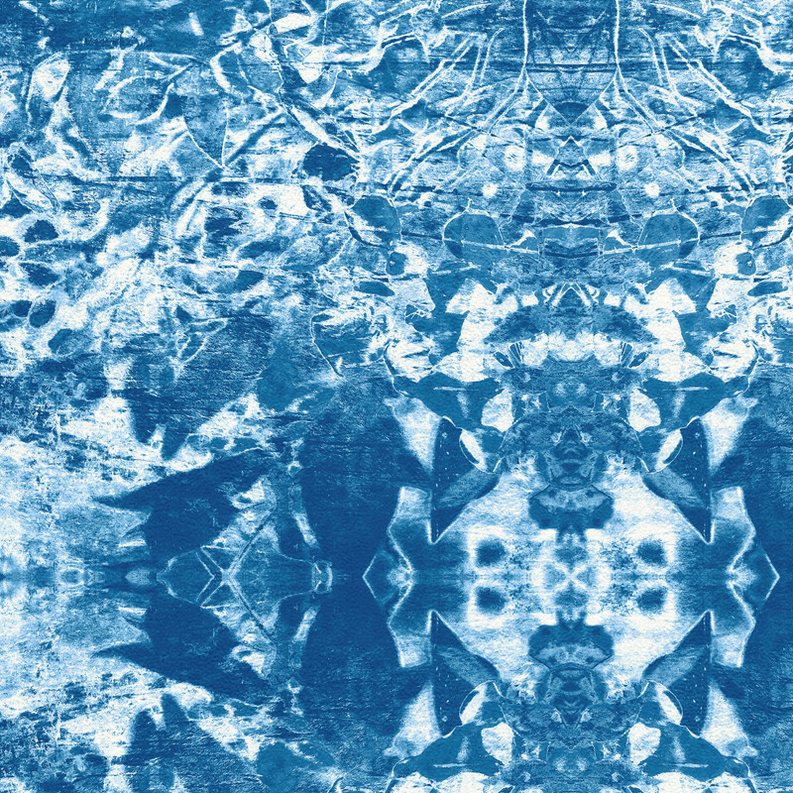 Abstract non-slip indoor/outdoor rug with blue textured geometric pattern and medallion center