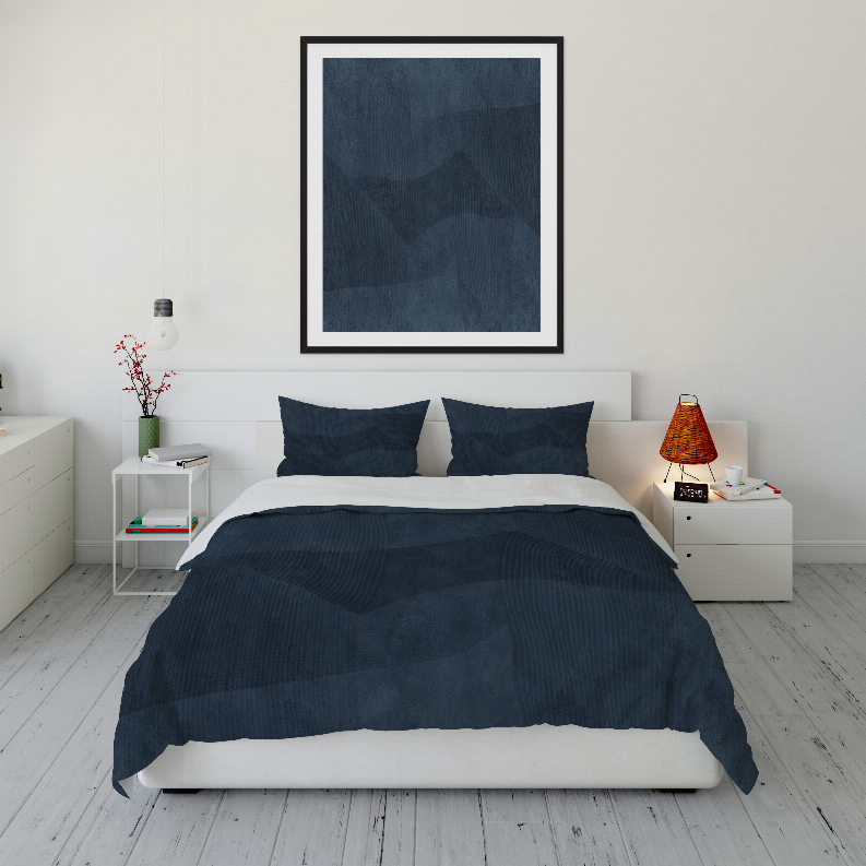 Dark blue comforter set with matching pillow covers and striped texture