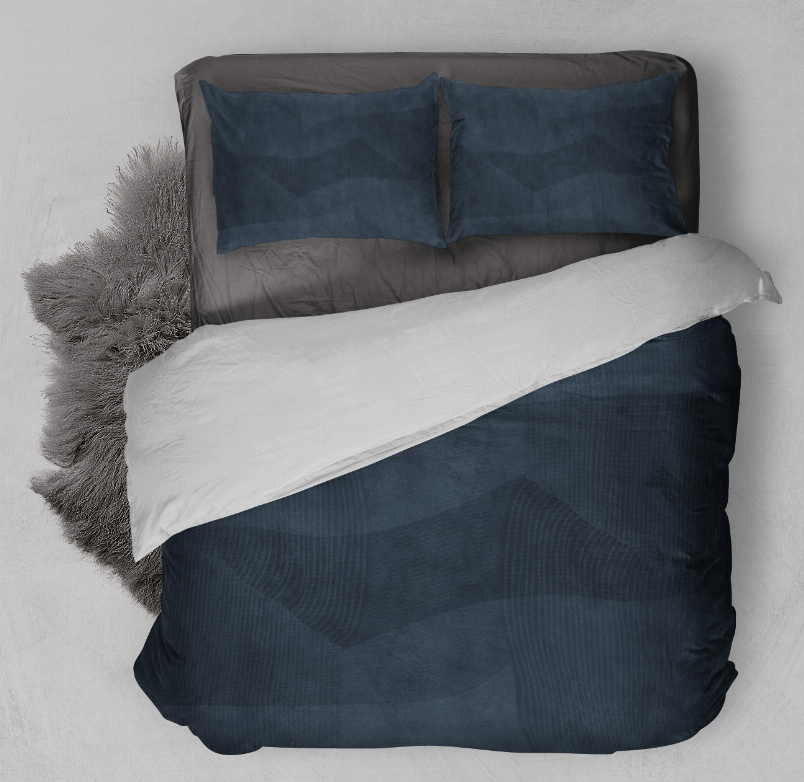 Navy comforter set with two pillow shams and textured patterned bedding
