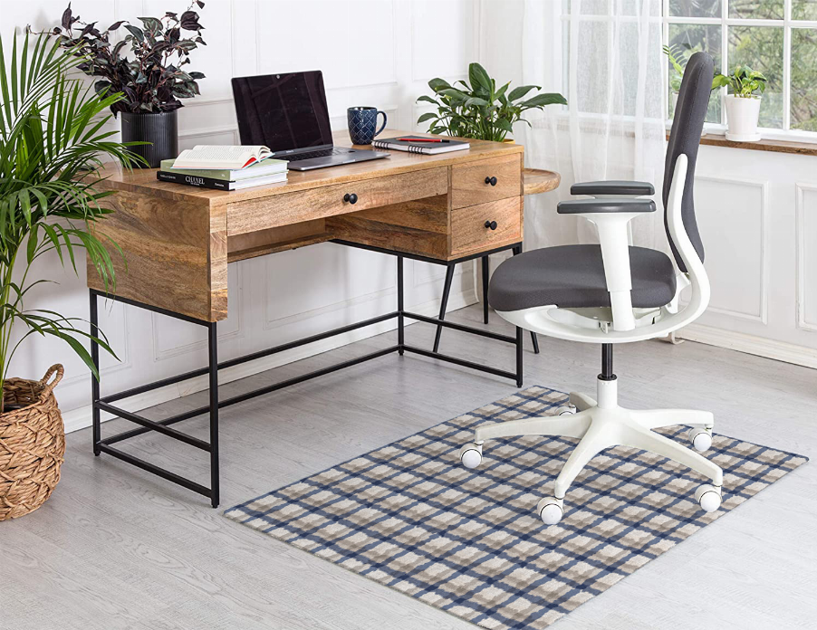 Low pile carpet with blue and cream plaid checkered pattern, rectangular rug