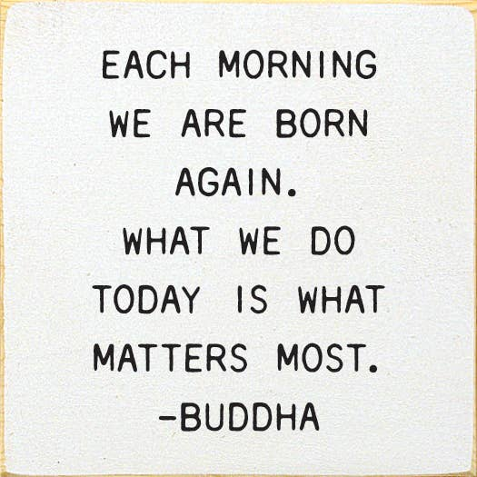 White square wall art with black Buddha quote text