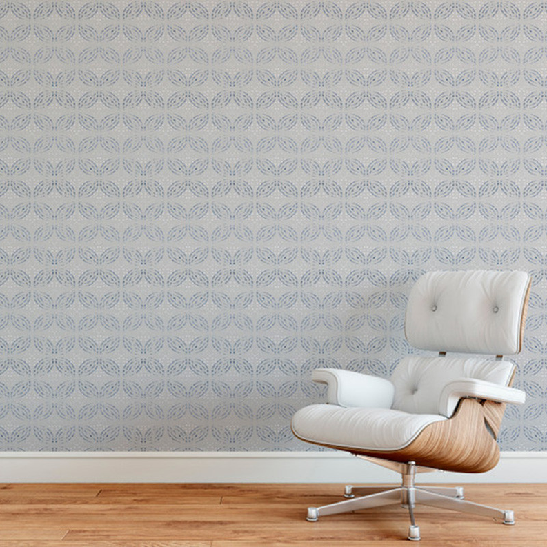 Designer wallpaper on wall with light blue repeating geometric leaf-circle pattern