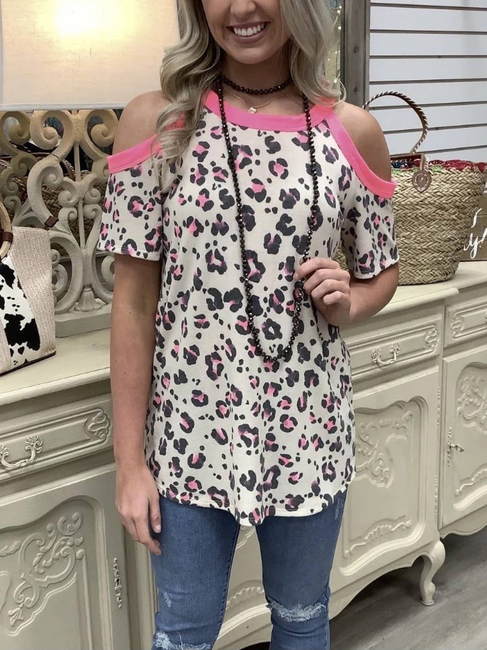 Leopard-print cold-shoulder tunic top with round neckline and pink accents