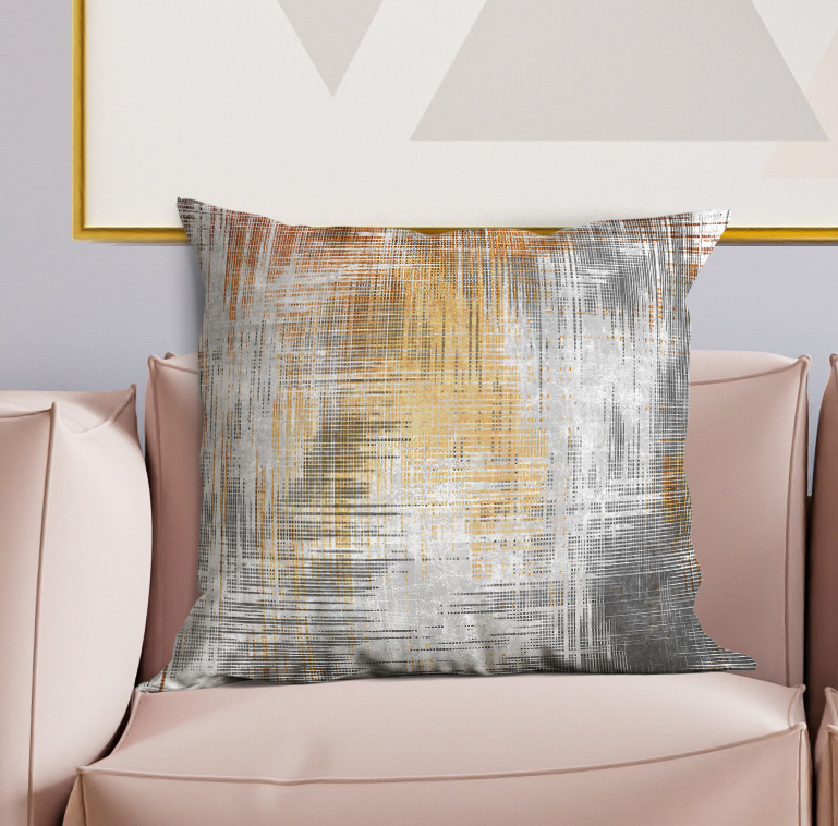 Grid patterned square pillow in gray, blue, and orange on a light background