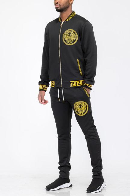 Black track set with gold lion crest on back, zip jacket, and matching joggers