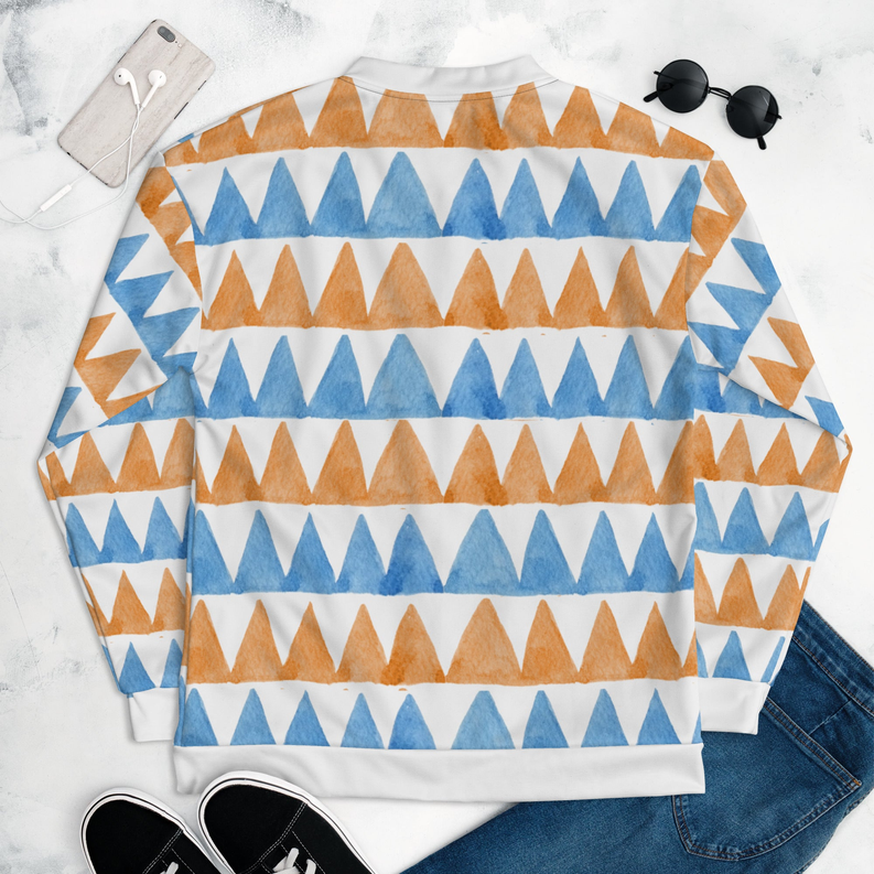 Unisex bomber jacket with blue and orange mountain stripe print, white trim and cuffs