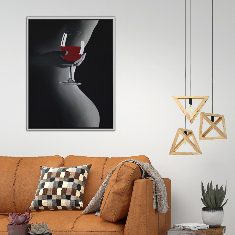 Framed art print showing red wine glass over black-and-white silhouette