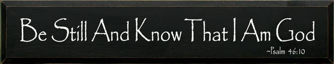 Wood sign with white cursive text: Be Still And Know That I Am God, Psalm 46:10