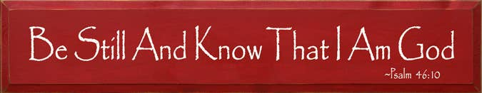 Red wooden sign with 'Be Still And Know That I Am God'