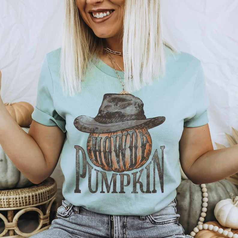 Light teal crewneck T-shirt with cowboy hat and 'Pumpkin' graphic, short sleeves