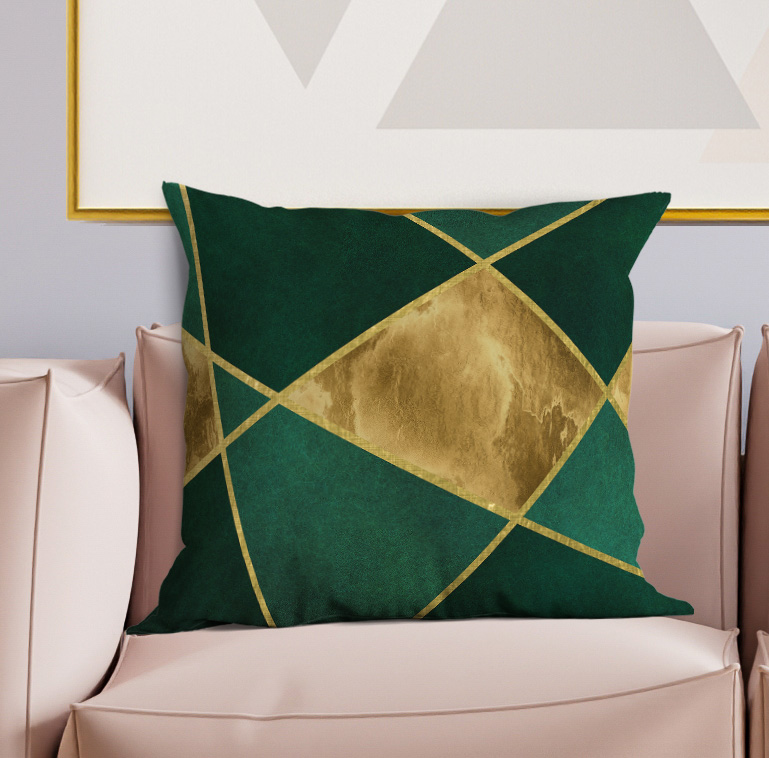 Dark green square throw pillow with gold crisscross and centered diamond pattern