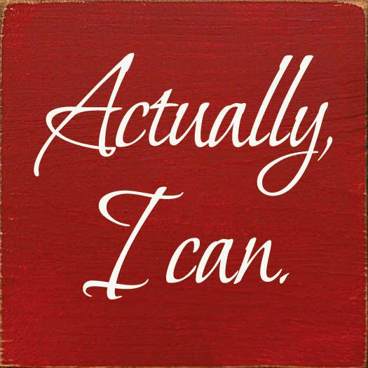 Red wood sign with white cursive text "Actually, I can".
