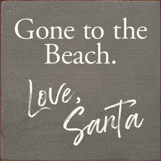 Gray decorative board with white text: Gone to the Beach, Love, Safta.