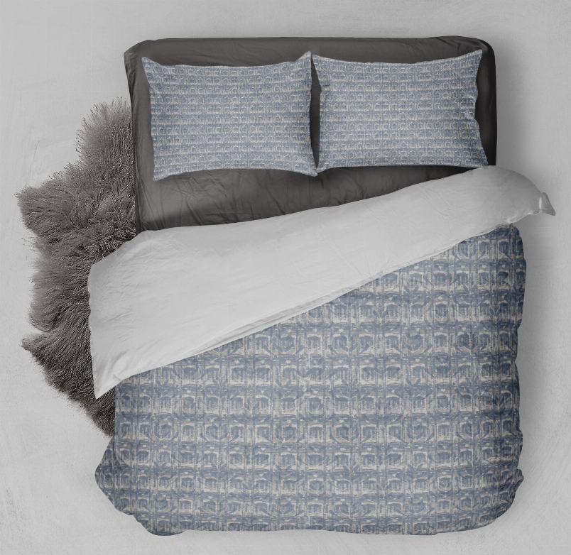 Blue patterned comforter set with two matching rectangular shams