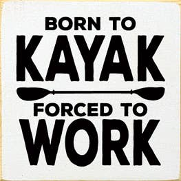 Wood sign with text: BORN TO KAYAK, FORCED TO WORK
