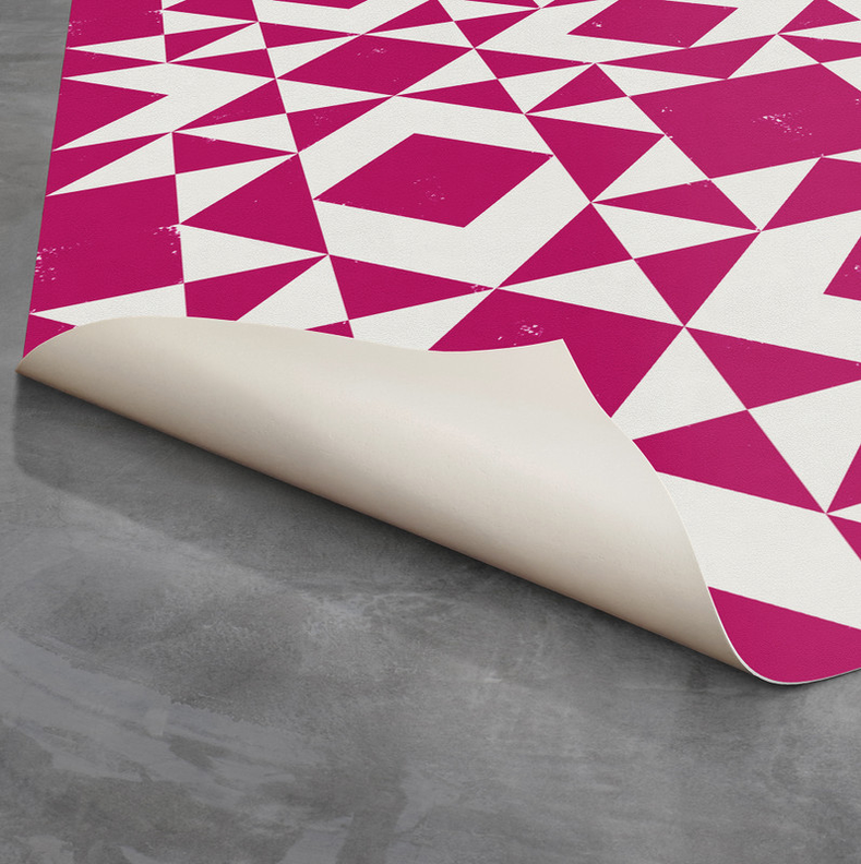 Pink and white geometric southwestern rug with rolled edge and beige backing