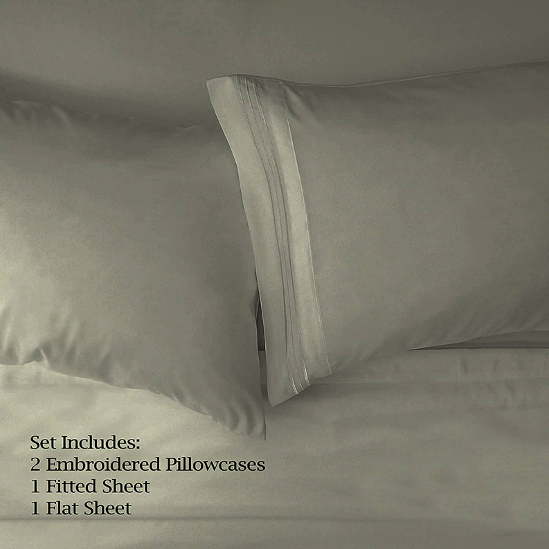 Sage sheet set showing fitted sheet and embroidered pillowcases with flat top sheet