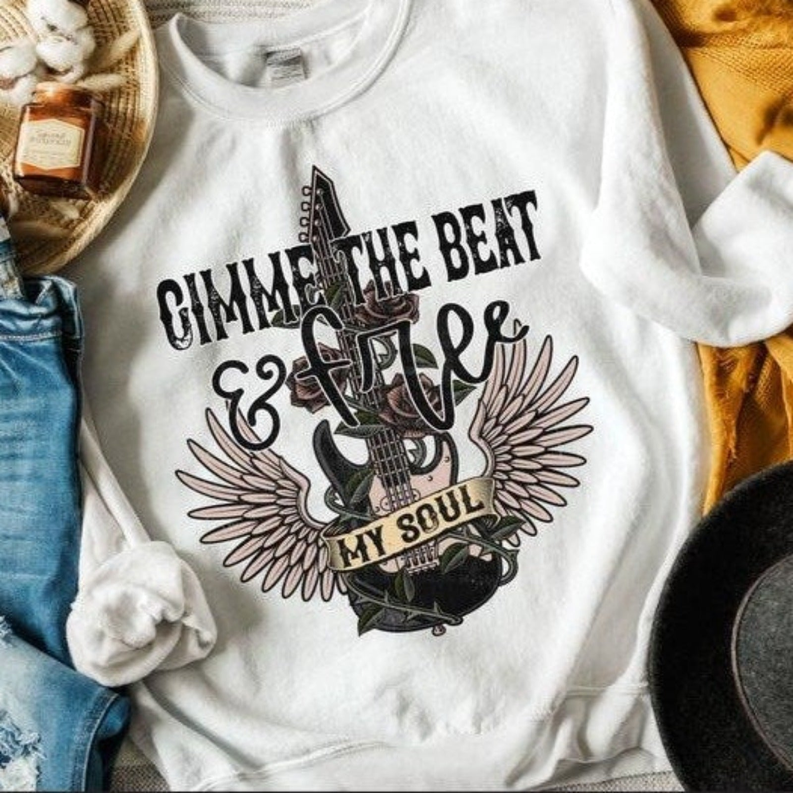 White sweatshirt with “Gimme the Beat” rock graphic and wings print