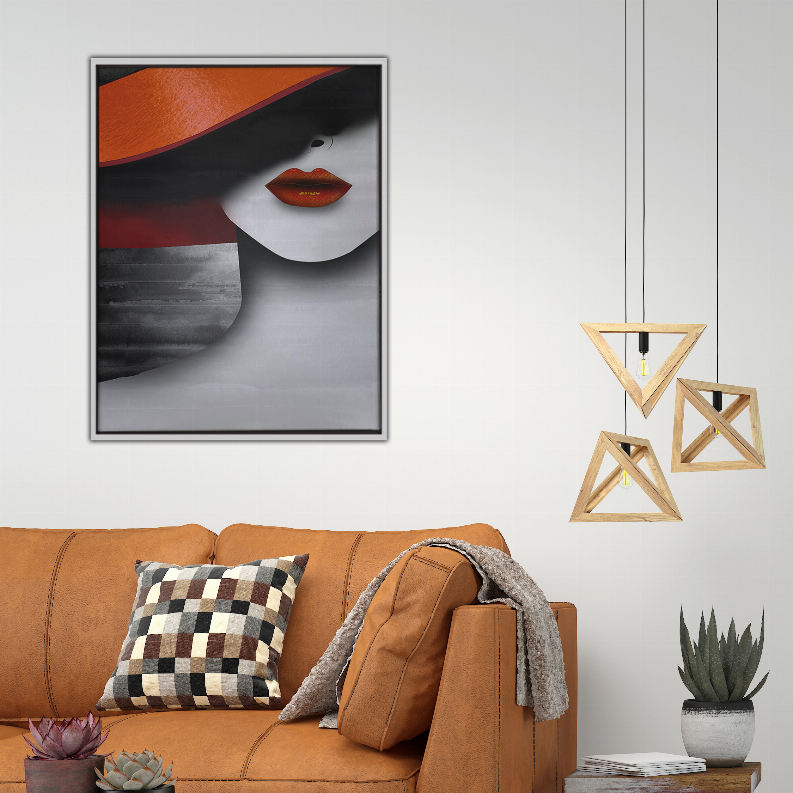Framed art print with abstract face and red lips on wall