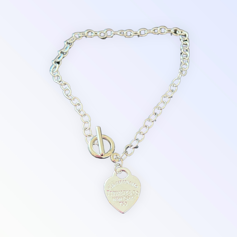 Heart charm necklace with silver chain and engraved heart pendant
