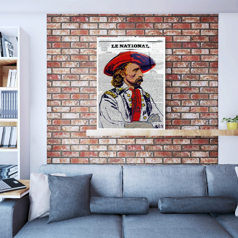 Framed General Custer glass wall art on brick wall above blue sofa