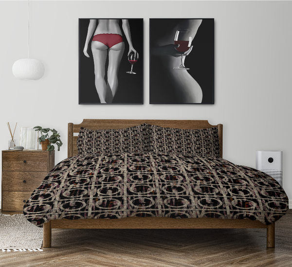 Multi-pattern comforter with matching pillow shams on bed