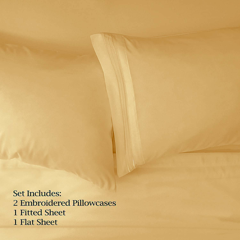 Gold sheet set with fitted and flat sheets, neatly folded
