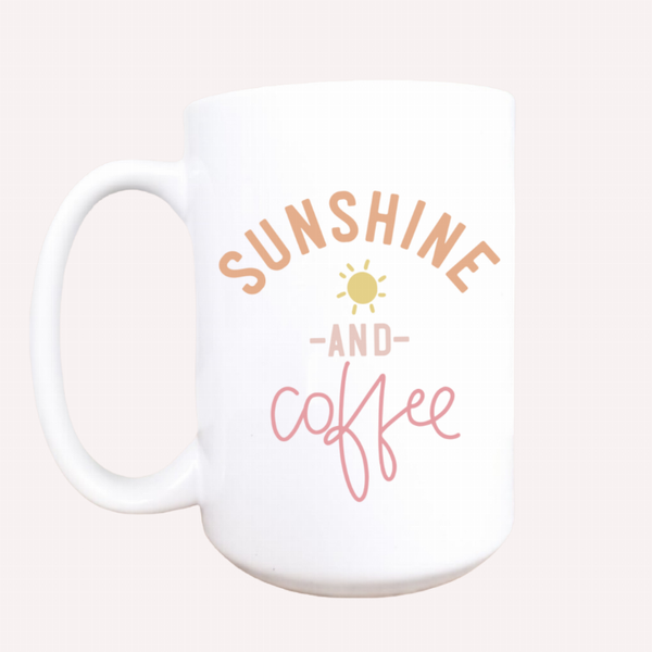 White ceramic coffee mug with “Sunshine and Coffee” lettering and sun graphic