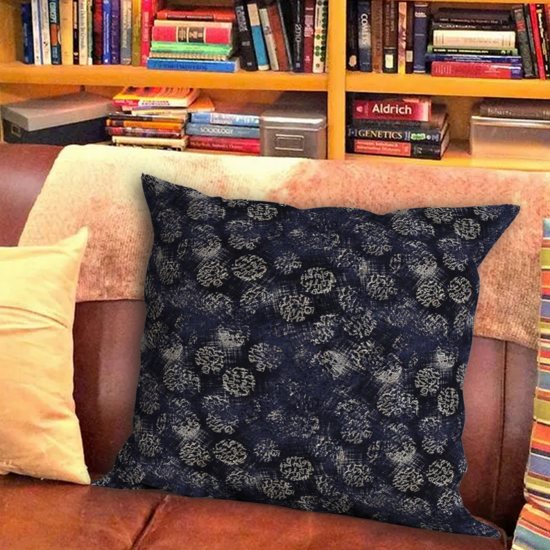 Dark blue decorative throw pillow with light patterned swirls, square shape