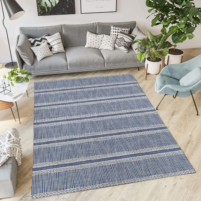 Blue low-pile carpet with striped woven pattern and border edge