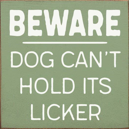 Green warning sign with white text: Beware dog can't hold its licker