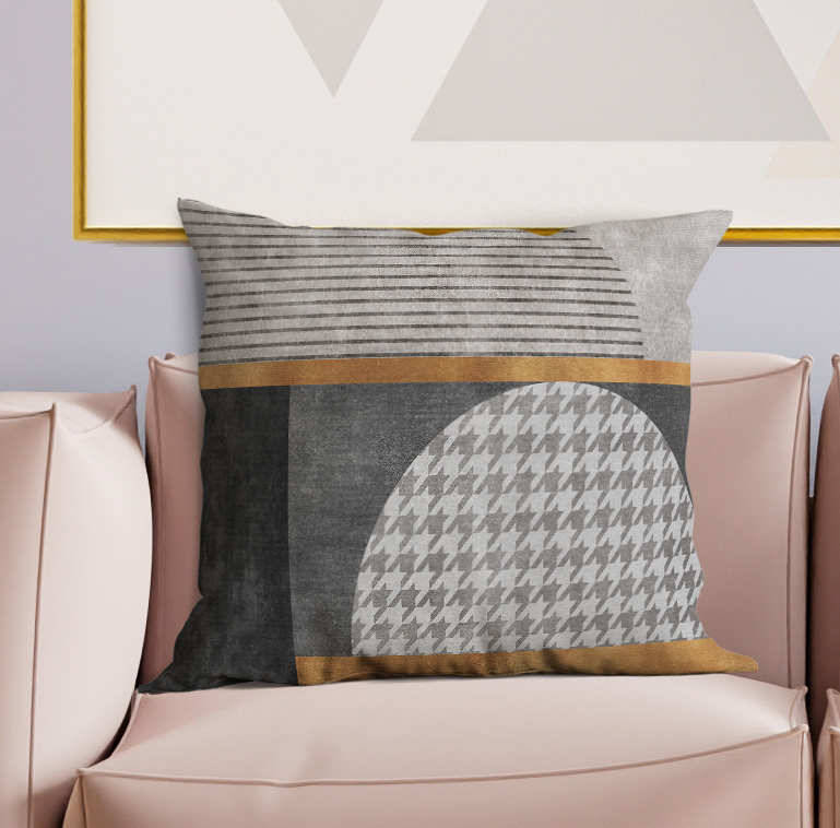 Decorative throw pillow with gray striped top, dark panel, and houndstooth circle design