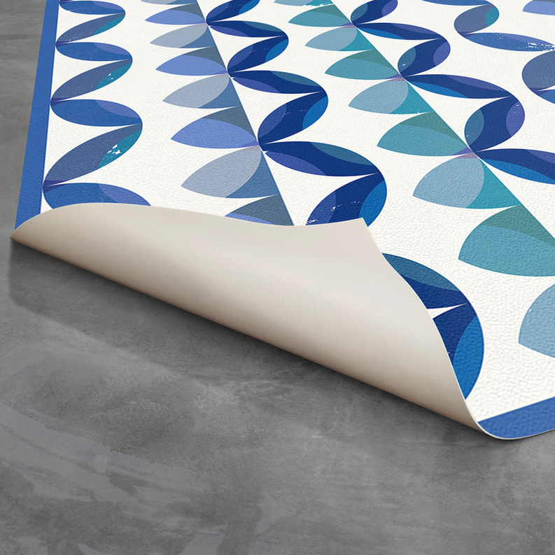 Blue and teal ripple striped non-slip indoor/outdoor rug with rolled edge