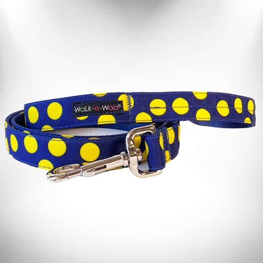 Navy dog leash with bright yellow polka dots and metal clip hardware