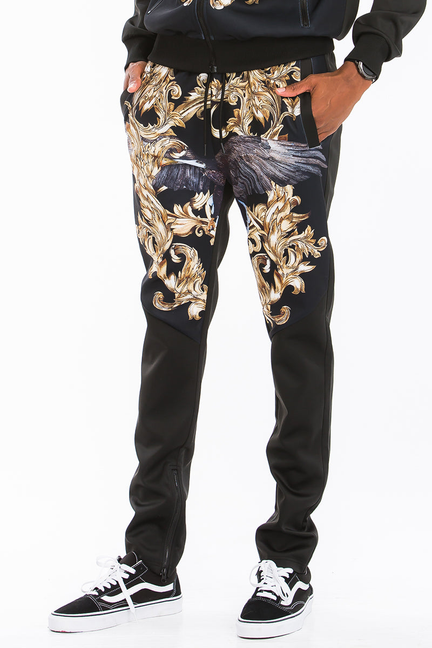 Black printed jogger pants with gold-and-blue baroque graphic and side seam detail
