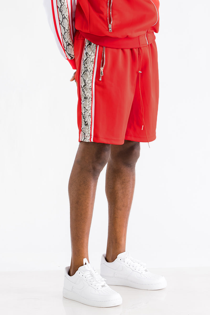 Red shorts with snake-print side stripe
