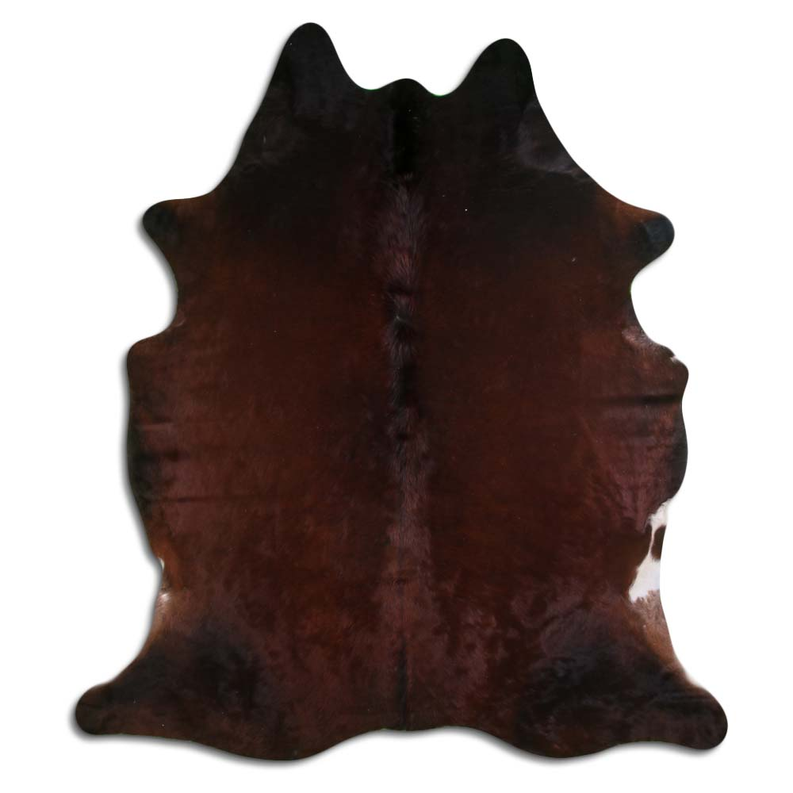 Natural cowhide rug with dark brown and black hair pattern, irregular hide shape