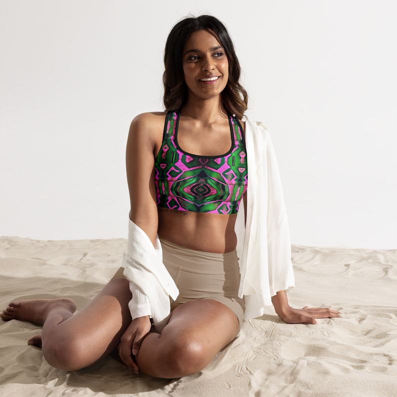 Neon geometric padded sports bra in pink and green with black neckline trim