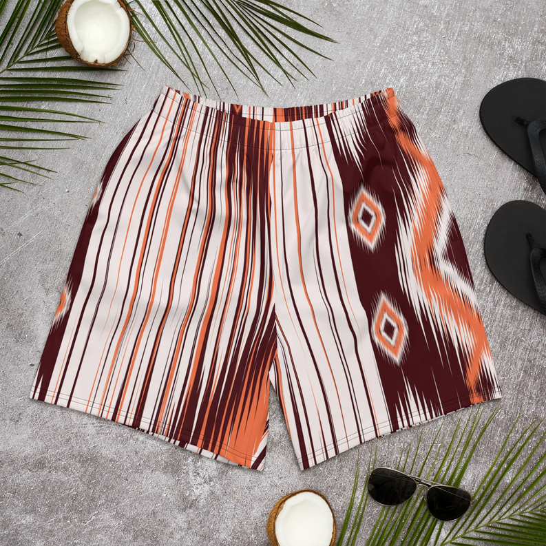 Men's swim shorts with vertical orange, white, and dark brown Aztec diamond print