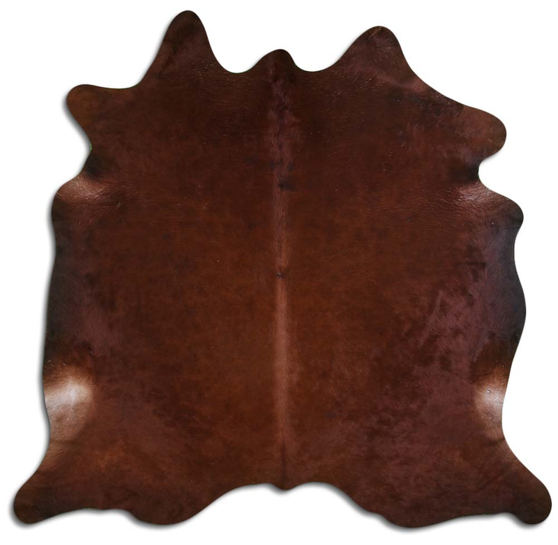 Brown cowhide rug with natural hair, irregular shape